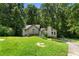 Charming home surrounded by lush greenery, featuring a well-maintained lawn and mature trees at 3323 Silver Ridge Ct, Duluth, GA 30096