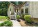 Inviting front entrance with stone accents, a cozy porch, and neat landscaping at 3323 Silver Ridge Ct, Duluth, GA 30096