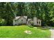 Charming two-story home featuring unique architectural details and a well-manicured front lawn at 3323 Silver Ridge Ct, Duluth, GA 30096
