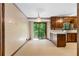 Cozy eat-in kitchen with wood cabinets, white countertops, and a sliding glass door to the back deck at 3323 Silver Ridge Ct, Duluth, GA 30096