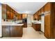 Well-appointed kitchen features ample wooden cabinetry and white countertops, offering functionality and classic charm at 3323 Silver Ridge Ct, Duluth, GA 30096