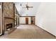 Expansive living room with a stone fireplace, vaulted ceilings, and a cozy atmosphere perfect for relaxation at 3323 Silver Ridge Ct, Duluth, GA 30096