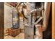 The utility room featuring a water heater, furnace, and ductwork ensures home comfort at 3323 Silver Ridge Ct, Duluth, GA 30096