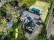 Aerial view of a beautiful home with a pool and lush landscaping at 4225 Wieuca Ne Rd, Atlanta, GA 30342