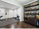 Finished basement with a bar area, exercise equipment, and stylish gray stone accent wall behind bar at 4225 Wieuca Ne Rd, Atlanta, GA 30342
