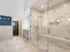 Gorgeous primary bathroom with marble shower featuring seating and glass door at 4225 Wieuca Ne Rd, Atlanta, GA 30342