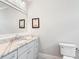 Elegant powder room with marble countertop and modern fixtures at 4225 Wieuca Ne Rd, Atlanta, GA 30342