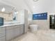 Bright primary bathroom featuring marble countertops, soaking tub, and walk-in closet access at 4225 Wieuca Ne Rd, Atlanta, GA 30342