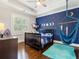 bedroom with celestial decorations and a blue hammock chair at 4225 Wieuca Ne Rd, Atlanta, GA 30342