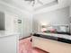 Cozy bedroom with a pink rug, white furniture, and ample natural light at 4225 Wieuca Ne Rd, Atlanta, GA 30342