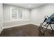 Well-lit bonus room featuring hardwood floors, a window with shutters, and an inversion table, a blank canvas for your dreams at 4225 Wieuca Ne Rd, Atlanta, GA 30342