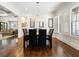 Formal dining room featuring hardwood floors, large windows with shutters and decorative trim at 4225 Wieuca Ne Rd, Atlanta, GA 30342