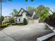 Charming home exterior with a well-maintained lawn and a spacious driveway at 4225 Wieuca Ne Rd, Atlanta, GA 30342