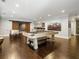 Entertaining game room featuring a pool table, foosball, wet bar, sliding barn doors and hardwood flooring at 4225 Wieuca Ne Rd, Atlanta, GA 30342