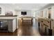Spacious game room with a pool table, foosball, bar area, and gleaming hardwood floors, perfect for entertaining guests at 4225 Wieuca Ne Rd, Atlanta, GA 30342