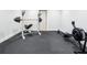 Home gym with modern exercise equipment and protective rubber flooring to help avoid slips and accidents at 4225 Wieuca Ne Rd, Atlanta, GA 30342