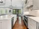 Modern kitchen with a large center island, stainless steel appliances, and plenty of natural light at 4225 Wieuca Ne Rd, Atlanta, GA 30342