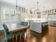 Stylish kitchen boasts custom cabinets, a center island, and high-end appliances, flowing into the dining area at 4225 Wieuca Ne Rd, Atlanta, GA 30342