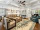 Spacious living room with hardwood floors, a coffered ceiling, and easy access to the dining and kitchen areas at 4225 Wieuca Ne Rd, Atlanta, GA 30342