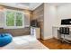 Comfortable office space with a built-in desk, a large window with shutters, and stylish wood accent wall at 4225 Wieuca Ne Rd, Atlanta, GA 30342