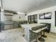 This outdoor kitchen features stainless steel appliances, ample countertop space, and bar seating at 4225 Wieuca Ne Rd, Atlanta, GA 30342
