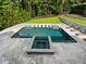 Luxurious pool and spa with sleek modern design, surrounded by a well-manicured lawn at 4225 Wieuca Ne Rd, Atlanta, GA 30342