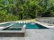 Stunning backyard pool featuring an integrated lounge area, hot tub, and patio, perfect for outdoor relaxation and enjoyment at 4225 Wieuca Ne Rd, Atlanta, GA 30342