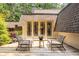 Charming back deck with woven chairs and garden view at 4850 Lake Fjord Pass, Marietta, GA 30068