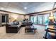 Spacious finished basement featuring a comfortable seating area and sliding doors to the outside at 4850 Lake Fjord Pass, Marietta, GA 30068