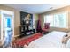 Bedroom with a daybed, hardwood floors, unique art, and lots of natural light at 4850 Lake Fjord Pass, Marietta, GA 30068