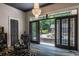 Bedroom featuring a chandelier and access to the backyard at 4850 Lake Fjord Pass, Marietta, GA 30068