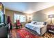 Cozy bedroom with unique decor, hardwood floors, and a window providing natural light at 4850 Lake Fjord Pass, Marietta, GA 30068
