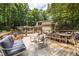 Inviting outdoor deck with comfortable seating, dining area, and a view of the sparkling swimming pool surrounded by lush greenery at 4850 Lake Fjord Pass, Marietta, GA 30068