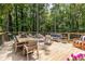Expansive wooden deck with stylish outdoor furniture, creating a perfect space for relaxation and entertaining amidst lush greenery at 4850 Lake Fjord Pass, Marietta, GA 30068