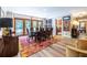 Elegant dining room with wood floors, modern lighting, and access to outdoor living spaces at 4850 Lake Fjord Pass, Marietta, GA 30068
