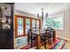 Bright dining room features natural lighting, stylish furnishings, and views of the outdoor scenery at 4850 Lake Fjord Pass, Marietta, GA 30068