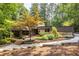 Beautiful home exterior with lush landscaping and a circular driveway, offering curb appeal and convenience at 4850 Lake Fjord Pass, Marietta, GA 30068