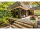 Exterior deck and facade with floor-to-ceiling windows, offering a seamless indoor-outdoor living experience at 4850 Lake Fjord Pass, Marietta, GA 30068
