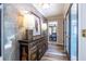 Elegant hallway with artistic accents, sophisticated lighting, and wood floors leading to the living spaces at 4850 Lake Fjord Pass, Marietta, GA 30068