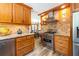 Well-equipped kitchen with stainless steel appliances, granite countertops, and wooden cabinetry at 4850 Lake Fjord Pass, Marietta, GA 30068