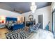 Bright main bedroom with chandelier, zebra rug, and backyard view at 4850 Lake Fjord Pass, Marietta, GA 30068