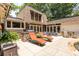 Spacious patio with outdoor seating and an outdoor kitchen, perfect for entertaining and enjoying the backyard pool at 4850 Lake Fjord Pass, Marietta, GA 30068