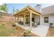 Backyard patio with a covered dining area, and ample seating for outdoor enjoyment at 549 Greenridge Ln, Loganville, GA 30052