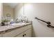 Well-lit bathroom featuring granite counters, stylish decor, and accessibility with convenient hand rails at 549 Greenridge Ln, Loganville, GA 30052