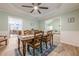 Spacious dining room with wood floors, wainscoting, and easy access to the living room at 549 Greenridge Ln, Loganville, GA 30052