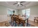 Bright dining room with views of the living room, and nice wood-look floors at 549 Greenridge Ln, Loganville, GA 30052