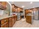Lovely kitchen with wood cabinets, stainless steel appliances and island prep area at 549 Greenridge Ln, Loganville, GA 30052