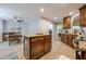 Open eat-in kitchen boasting center island, stainless oven and appliances, and wood cabinetry at 549 Greenridge Ln, Loganville, GA 30052