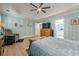 Spacious main bedroom features tray ceiling, ceiling fan, dresser, and ensuite bathroom at 549 Greenridge Ln, Loganville, GA 30052