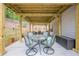 Covered outdoor patio features a glass table, comfortable seating, and a relaxing atmosphere at 549 Greenridge Ln, Loganville, GA 30052